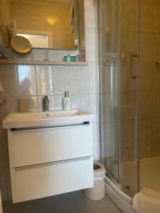 a bathroom with a sink and a shower at Villa Mira in Bol +172 photos