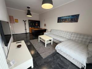 a living room with a couch and a table at City View Apartment in Mytilene