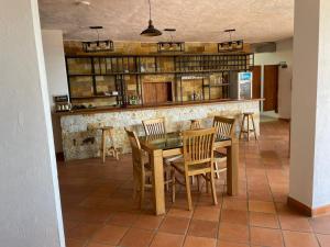 a dining room with a table and chairs at Hotel Lengerke Barichara in Barichara