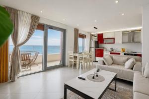 a living room with a view of the ocean at Luxury sea view duplex in Durrës