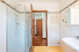 a bathroom with a shower and a sink at Maranello Suite in Maranello