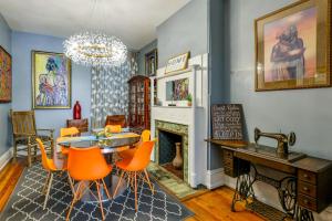 a living room with a table and chairs and a fireplace at Historic Georgetown Townhome: Walkable Location! in Washington, D.C.
