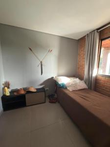 a bedroom with a bed and a clock on the wall at Imperial Rodrigues Valley in Juquitiba +69 photos