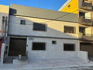a building with a bunch of windows on it at Residencial Bom Sossego Apto 01 in Itabuna