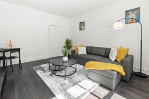 a living room with a couch and a table at Cheshire Dimond one bedroom flat in Warrington in Warrington +32 photos
