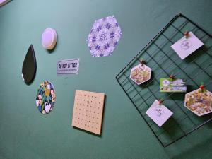 a table with pinned notes and other items on it at Hotel SN Legacy in Kuala Terengganu