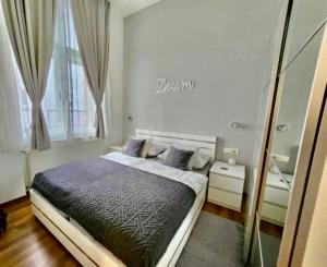 a bedroom with a large bed and a window at Main Square Dream Apartment in Zagreb +50 photos