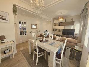 a dining room and living room with a table and a couch at A un paso de Bilbao in Galdakao
