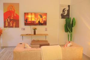 a living room with a couch and a table at Polea Hapa Ruaka in Nairobi