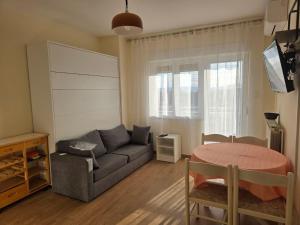 a living room with a couch and a table at Apartments with parking space Punat, Krk - 5410 in Punat
