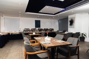 a dining room with a table and chairs at Medhal Hotel in Jeddah