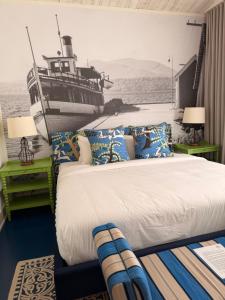 a bedroom with a bed and a boat on the wall at Auberge McGowan in Austin +5 photos