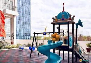 a childrens playground with a playground slide with a crown on it at Davao city One Lakeshore Drive at the back of sm lanang in Davao City