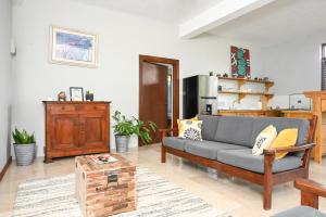 a living room with a couch and a table at Hidden Secret in Gros Islet