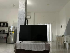 a large flat screen tv in a living room at Misha Home Nro 732 in Puerto Ayora