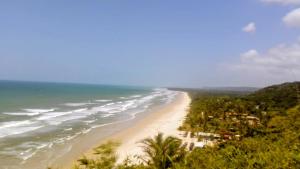 an aerial view of a beach with the ocean at Cantinho da Paz in Serra Grande +10 photos