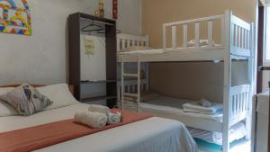 a small bedroom with two bunk beds with towels at Pousada Cabocla - Centro de Alter in Alter do Chao +86 photos