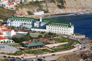 an aerial view of a large building next to the ocean at Vila Gale Ericeira in Ericeira
