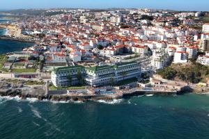 an aerial view of a city next to the ocean at Vila Gale Ericeira in Ericeira