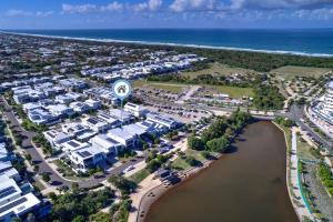 an aerial view of a resort next to the ocean at Sunshine Coast Escape | Beachside, Pool & Views in Kawana Waters