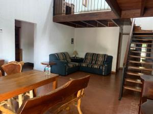 a living room with a couch and a table at Antigua Mariana Hotel Boutique in Cedro
