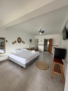 a bedroom with a bed and a flat screen tv at Costa Nueva Hotel in Zorritos +41 photos