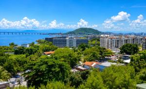 a city with a bridge in the background at Apartamento Vista Ponte in Niterói