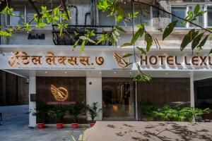 a hotel sign on the front of a building at Hotel Lexus7 in Mumbai