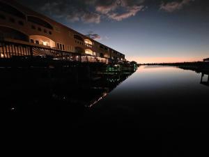 a building sitting next to a body of water at La Sirena Pescadora in Corpus Christi