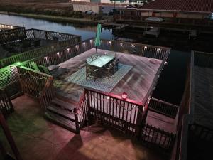 an overhead view of a table on a deck in the water at La Sirena Pescadora in Corpus Christi