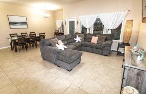 a living room with a couch and a dining room at La Sirena Pescadora in Corpus Christi