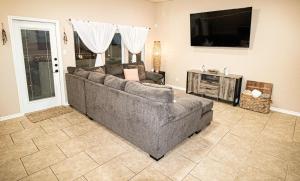 a living room with a couch and a flat screen tv at La Sirena Pescadora in Corpus Christi +48 photos