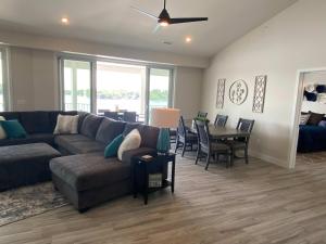 a living room with a couch and a table at Lakeview Luxe Penthouse in Rocky Mount