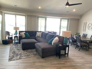 a living room with a couch and a table at Lakeview Luxe Penthouse in Rocky Mount