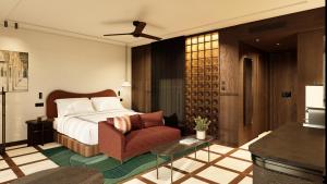 a hotel room with a bed and a chair at Thompson Seville, by Hyatt in Seville