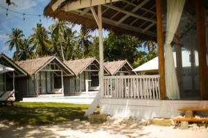 a view of a resort with a porch at Adams Villas in Katiet