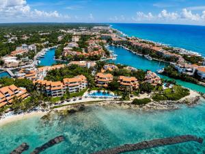 an aerial view of the resort and the ocean at Beachfront condo with loft and sea views in Puerto Aventuras