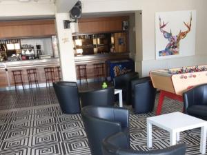 a restaurant with a ping pong table and chairs at Chalet avec animaux admis - 4 pers. - API-1-52-2772 in Sainte-Montaine