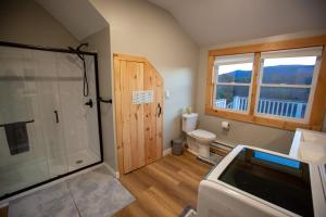 a bathroom with a shower and a toilet at Beautiful Bridgton Apartment in Bridgton +7 photos