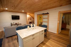 a room with a kitchen with a table and chairs at Beautiful Bridgton Apartment in Bridgton