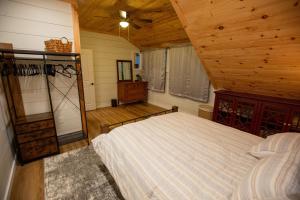 a bedroom with a bed and a wooden ceiling at Beautiful Bridgton Apartment in Bridgton