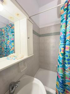 a bathroom with a sink and a toilet and a shower at Seaside Apartment in Vrachati