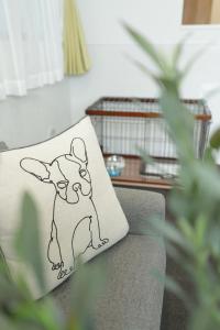 a pillow with a drawing of a dog on a couch at Casa Stella 8 by Liaison カーサステラ8 byリエゾン in Osaka +60 photos