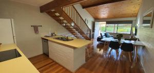 a kitchen and living room with a sink and a counter at Great Escape Lofts in Gloucester