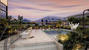 a view of a building with a swimming pool at Thompson Seville, by Hyatt in Seville +88 photos