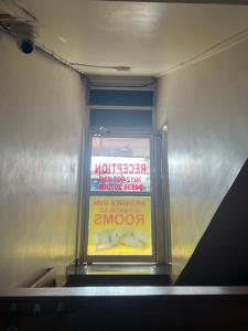 a sign in a window of a subway train at morriz inn in Kalpetta