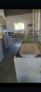 a kitchen with a counter top in a room at Recanto do Batata in Atibaia