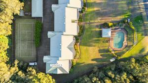 an aerial view of a house with a yard at Fathoms 13 Mollymook Beach in Mollymook