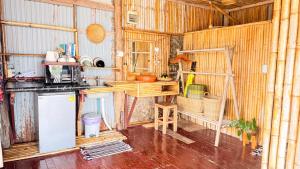 a kitchen with wooden walls and a counter in a room at Deep House Sea View in Ko Lanta +113 photos