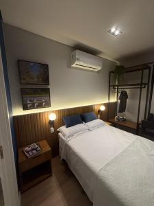 a bedroom with a bed and a air conditioner on the wall at Hotel In Loft Elleva Studio in Sinop